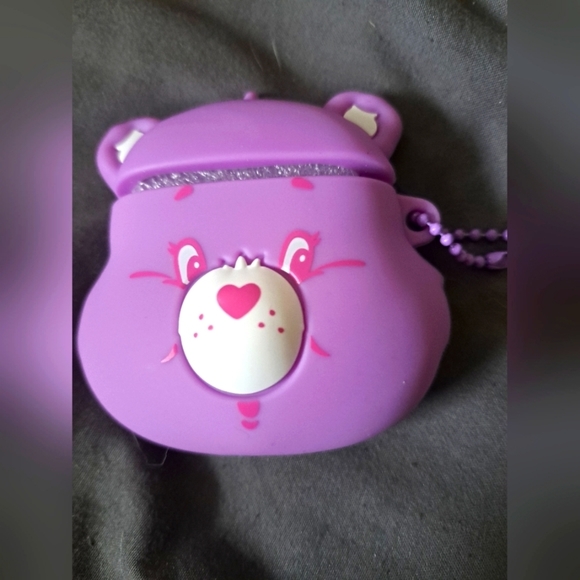 NWT care bears 40th anniversary edition earbuds holder.